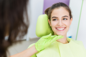 a teen talking with her orthodontist